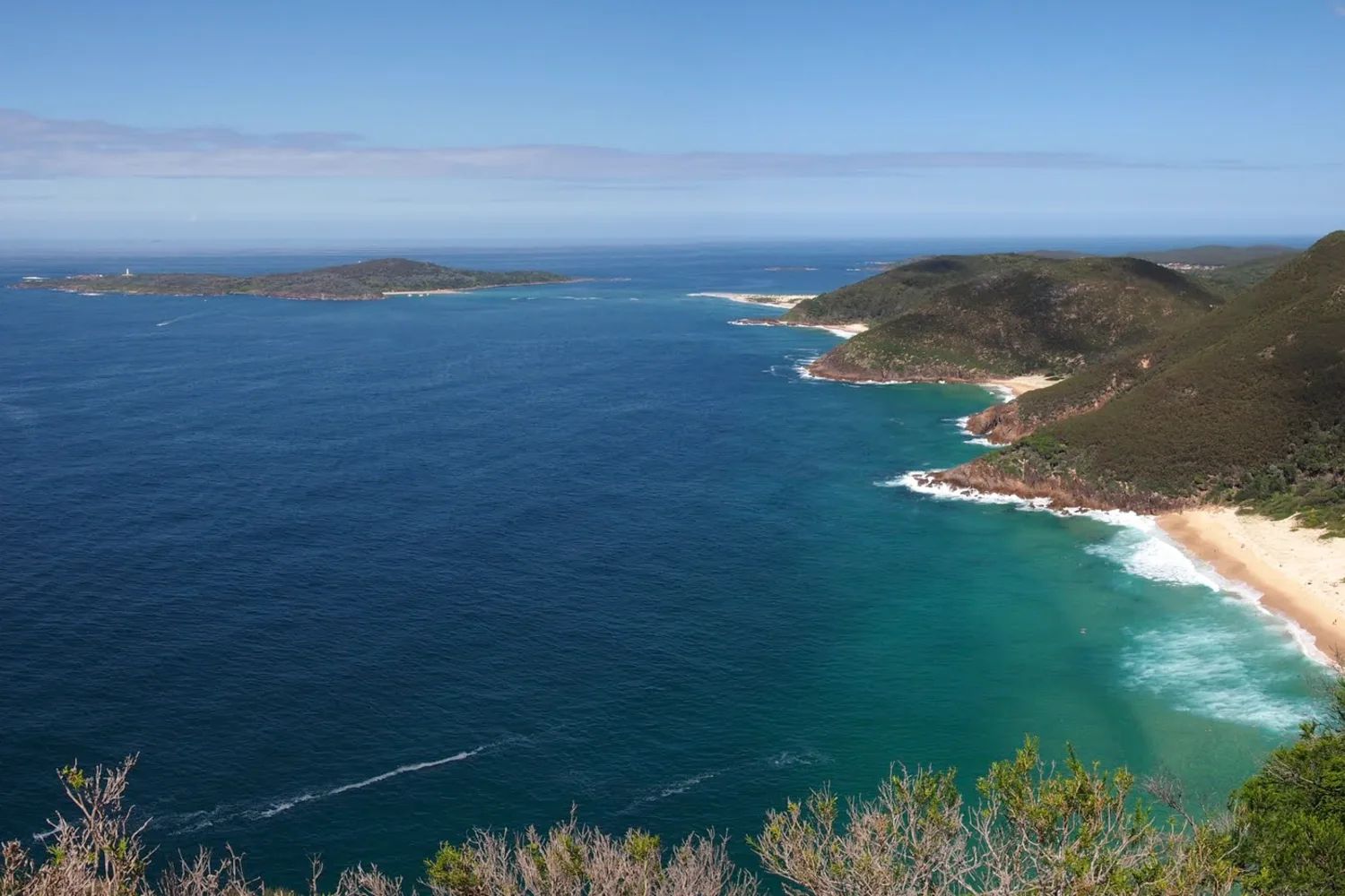 The view from Tomaree Head over the open ocean, with the national-park headlands and beaches running south