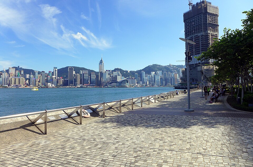 The Tsim Sha Tsui promenade with the island skyline across the harbour