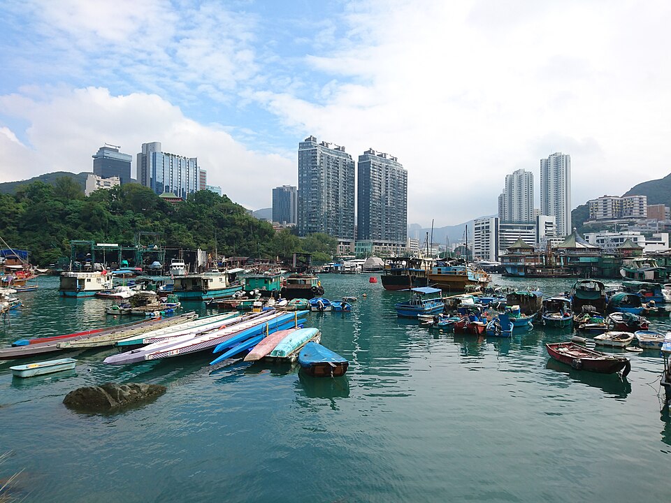 Boats moored in Aberdeen's typhoon shelter with Ap Lei Chau's towers beyond