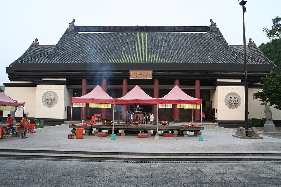 Che Kung Temple's main hall with incense stands before it